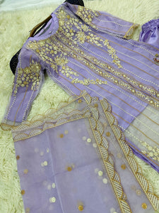 Lilac organza shirt with embroidery and silk wide leg trouser.
