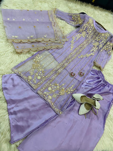 Lilac organza shirt with embroidery and silk wide leg trouser.