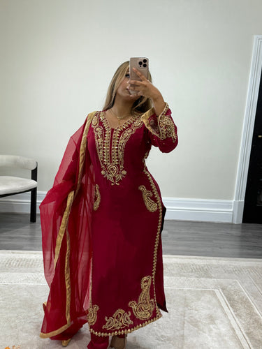 Beautiful handwork embroidered suit in red silk with cotton net duppata and trouser. Perfect wedding wear suit.