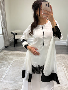 black and white embroidered raw silk suit with silk plazzo and chiffon duppata party wear suit