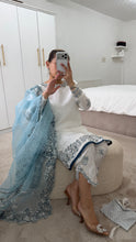 Load image into Gallery viewer, Blue and white Embroidered silk suit with embroidered organza duppata and trouser. And Matching purse Party wear. Eid collection.