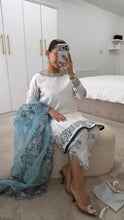 Load image into Gallery viewer, Blue and white Embroidered silk suit with embroidered organza duppata and trouser. And Matching purse Party wear. Eid collection.