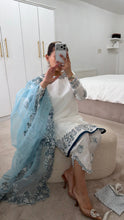Load image into Gallery viewer, Blue and white Embroidered silk suit with embroidered organza duppata and trouser. And Matching purse Party wear. Eid collection.