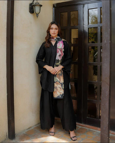 Black schiffli suit with chikankari embroidery and duppata.