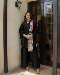 Black schiffli suit with chikankari embroidery and duppata.