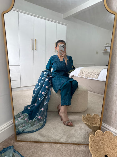 Teal embroidered suit with full embroidered shirt and beautiful embroidered organza duppata and trouser.