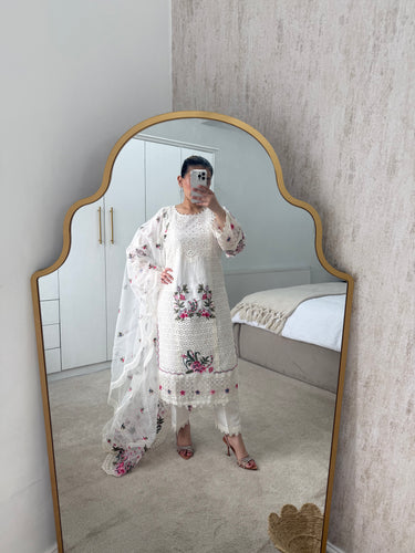 White floral embroidered suit with full embroidered shirt and beautiful embroidered organza duppata and trouser.